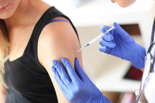 Provider giving an allergy immunotherapy injection.